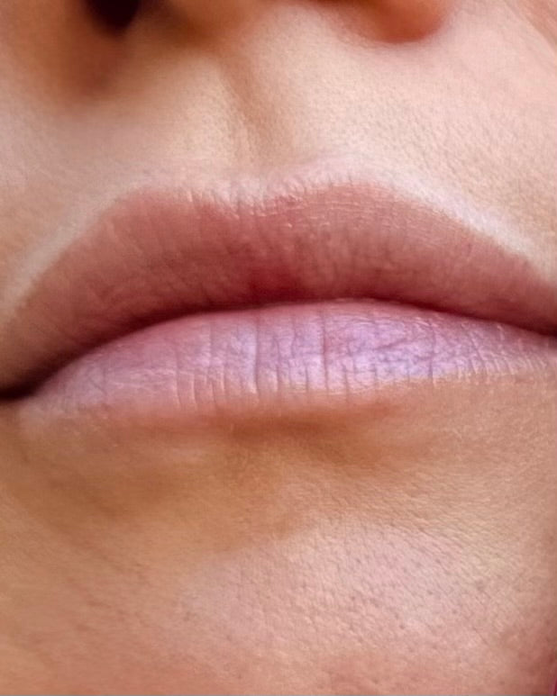 Close-up of a person's lips with a blurred background