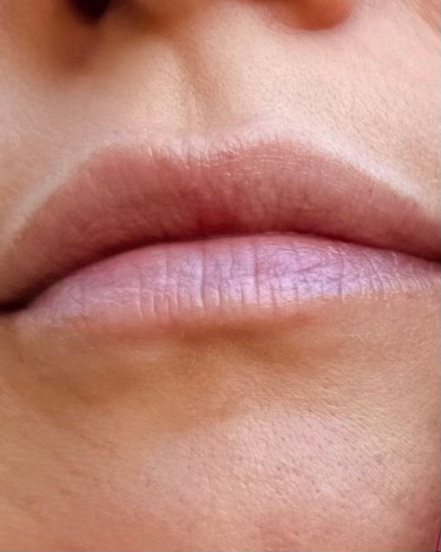 Close-up of a person's lips with a blurred background